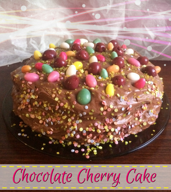 Chocolate Cherry Cake - Anna Can Do It! Rich, moist and dense chocolate cake with cherry and vanilla cream filling layers and creamy, fluffy chocolate ganache frosting.
